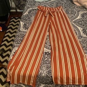 orange and white strip dress pants
